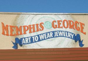 Painted wall sign, hand-painted on stucco